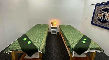 Relaxing massage room at Acacia Thai Massage, Melbourne, Victoria, AU, with soothing decor and twin beds.