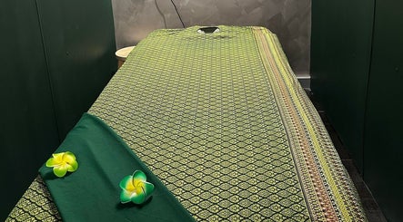 Elegant Thai Massage therapy room with a traditional massage bed in Melbourne, Australia, AU.