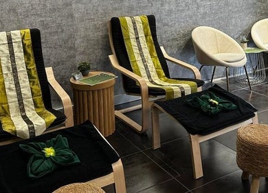 Relaxing seating area at Elegant Thai Massage in Melbourne, Australia, AU, featuring comfortable chairs and soft decor.