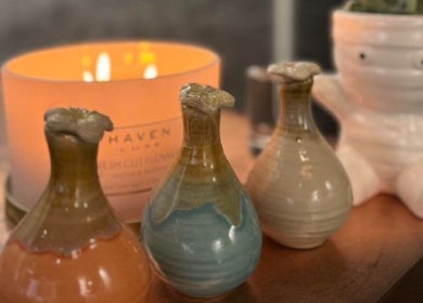 Elegant Thai Massage decor with vases and candle in Melbourne, Australia, AU, creating a calming atmosphere.