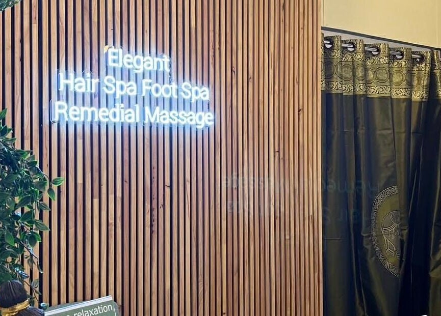 Elegant Thai Massage, Hair Spa and Foot Spa entrance in Melbourne, Victoria, AU with greenery and wood décor.