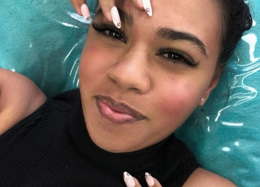 Smiling woman with glam nails at Get It Bae Cpt, Cape Town, Western Cape, ZA.