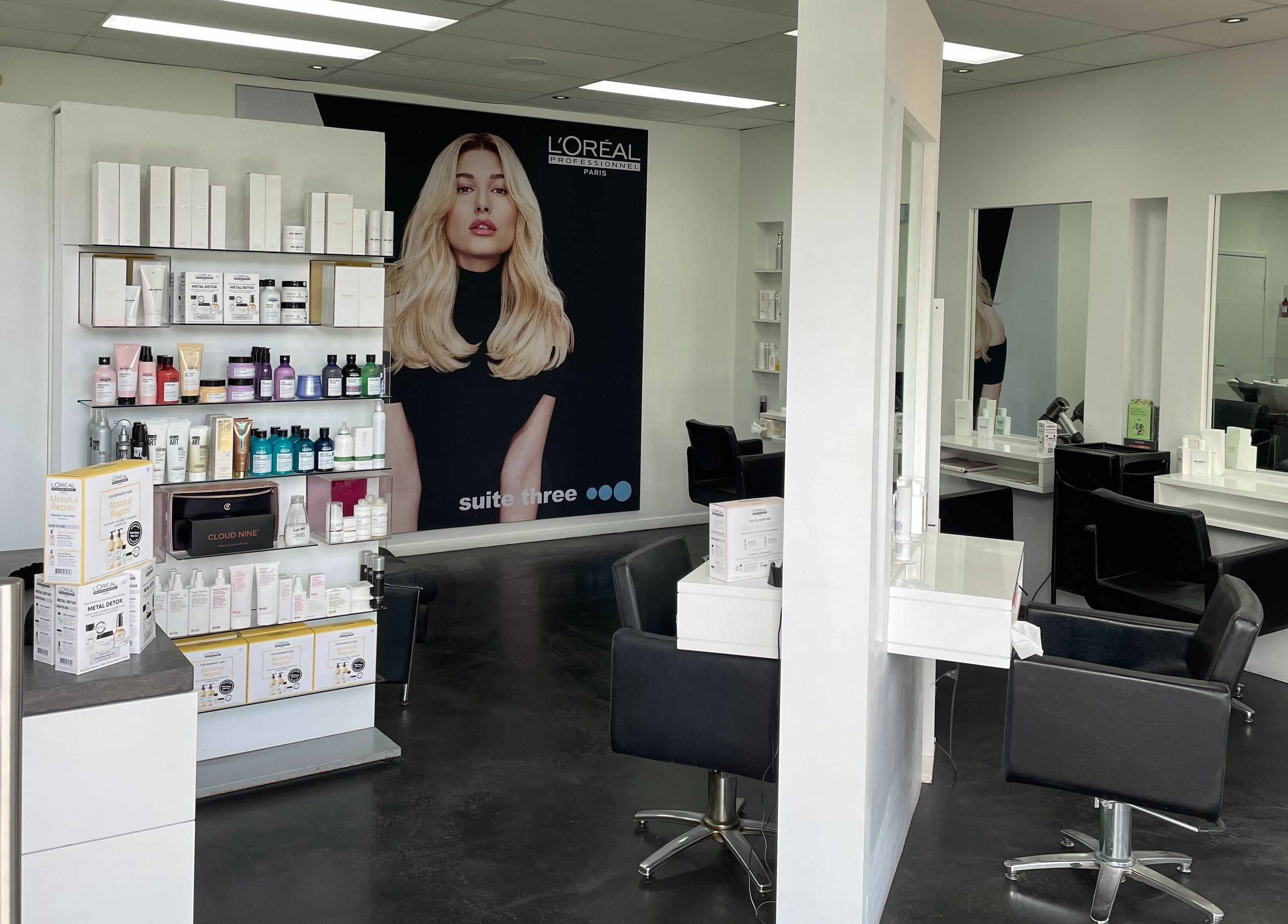 Suite Three salon interior showcasing products and styling chairs in Buderim, Queensland, AU.