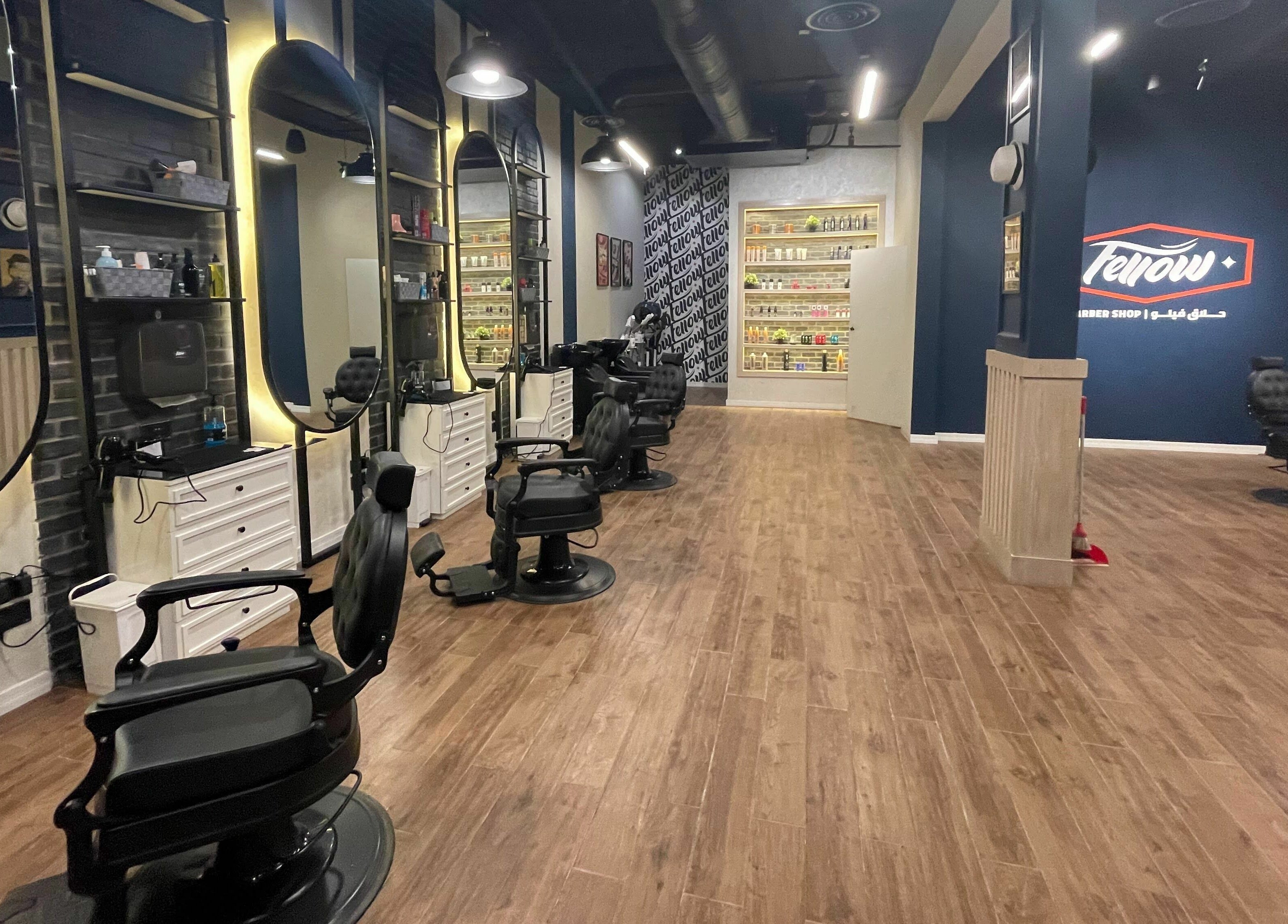 Stylish interior of Fellow | حلاق فيلو in Riyadh, Riyadh Province, SA with modern barber chairs and mirrors.