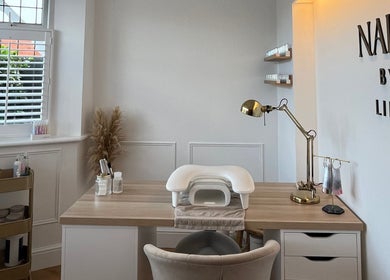 Elegant nail station at NailsByLily in Hinckley, England, GB with modern decor and tools.