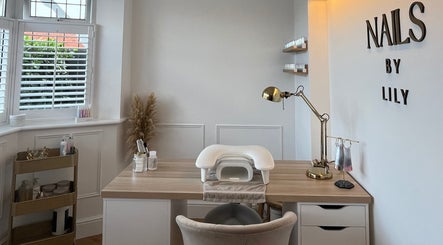 Elegant nail station at NailsByLily in Hinckley, England, GB with modern decor and tools.
