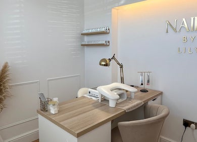 Elegant nail station at NailsByLily in Hinckley, England, GB, featuring modern decor and cozy seating.