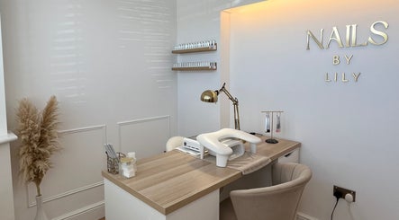 Elegant nail station at NailsByLily in Hinckley, England, GB, featuring modern decor and cozy seating.