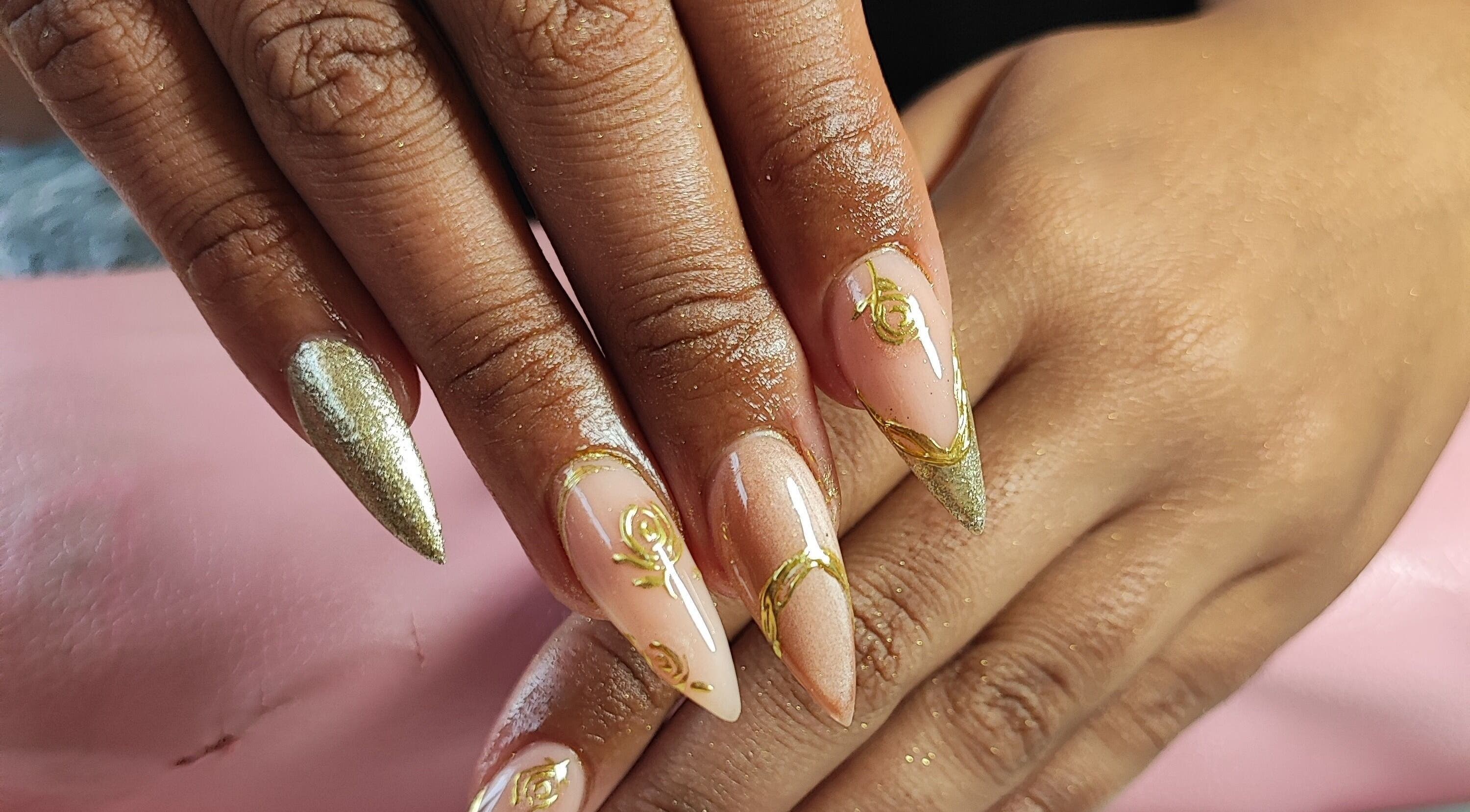Intricate nail art with golden details at Micakayla's Nail Room, Ennerdale, Gauteng, ZA.