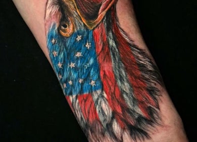 Intricate eagle tattoo with USA flag at Bonaire Ink Tattoo and Piercing Shop, Kralendijk, Bonaire, BQ.