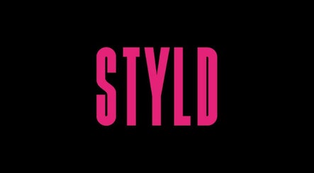 STYLD logo in vibrant pink on black background at South Parade, Bath, England, GB