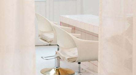 Modern styling chairs at STYLD, South Parade, Bath, England, GB. A sleek and comfortable beauty space.