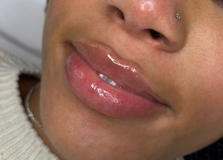 Close-up of glossy lips at Face Studios in Coulsdon, England, GB, showcasing expert beauty treatment.