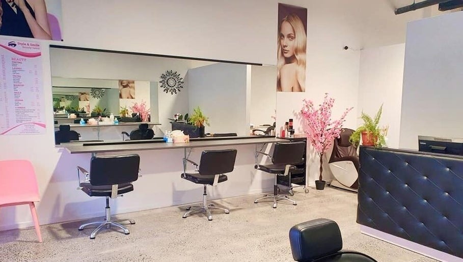 Modern salon interior at Style and Smile Beauty Parlour, Hamilton, Waikato, NZ, featuring elegant styling stations.