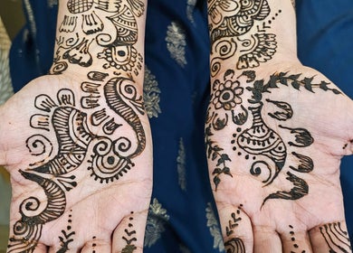 Intricate henna design on palms at Style and Smile Beauty Parlour, Hamilton, Waikato, NZ.