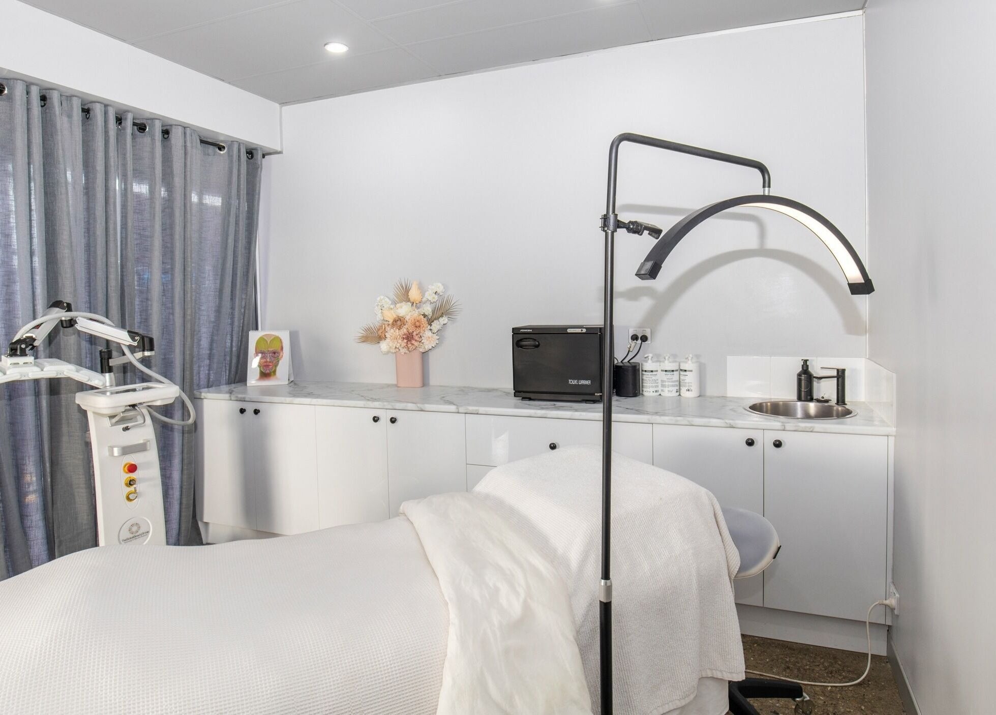 Calm and inviting treatment room at Skin at Bardon, Bardon, Queensland, AU, showcasing modern wellness equipment.