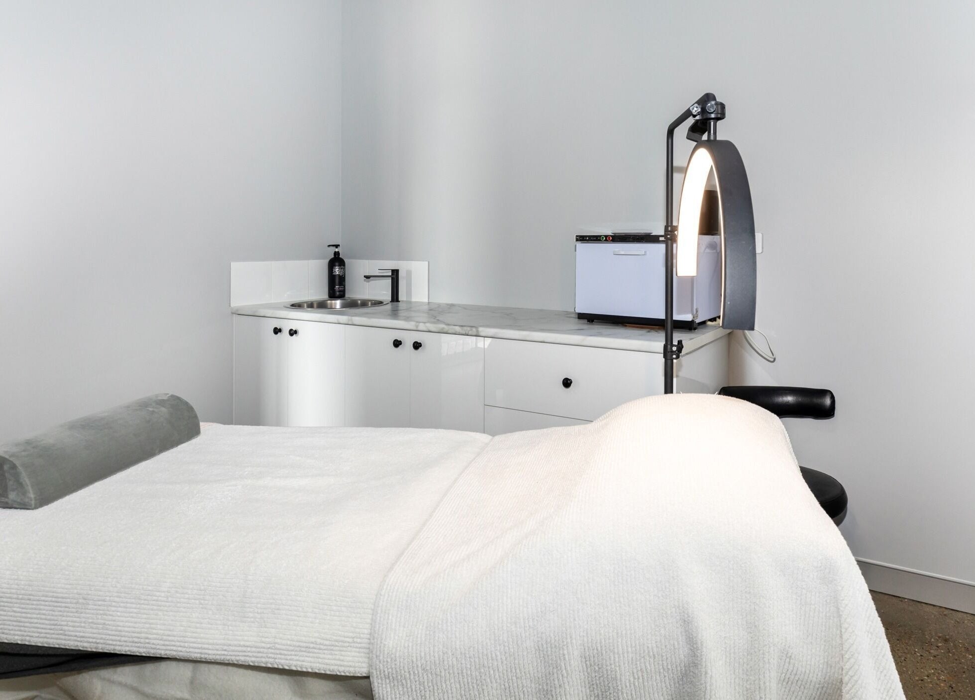 Professional treatment room at Skin at Bardon, located in Bardon, Queensland, AU, featuring a serene setup.
