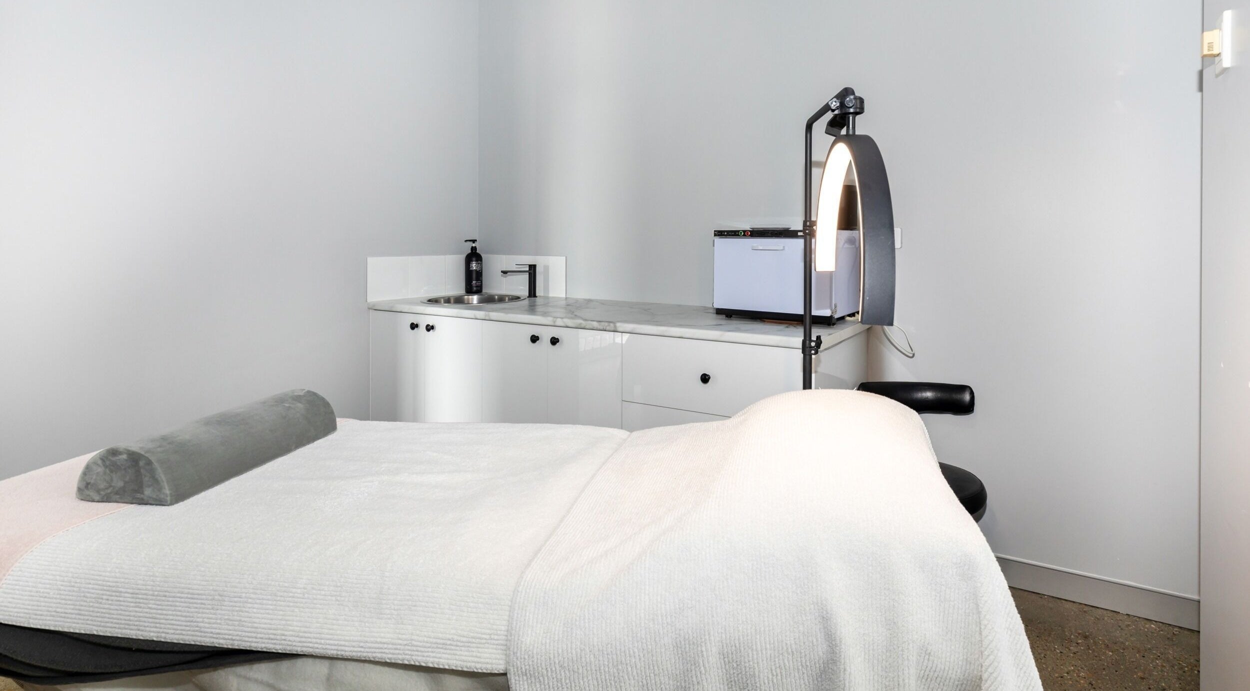 Professional treatment room at Skin at Bardon, located in Bardon, Queensland, AU, featuring a serene setup.