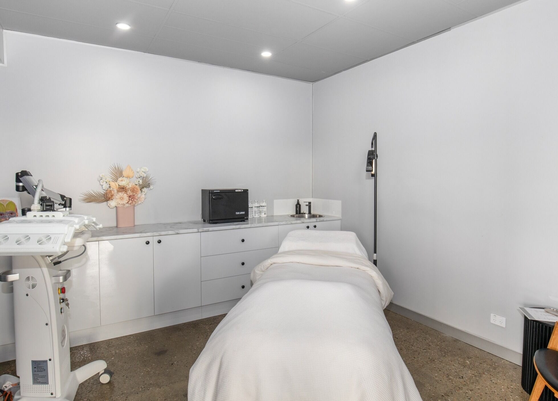 Tranquil treatment room at Skin at Bardon, Bardon, Queensland, AU, showcasing modern spa facilities.