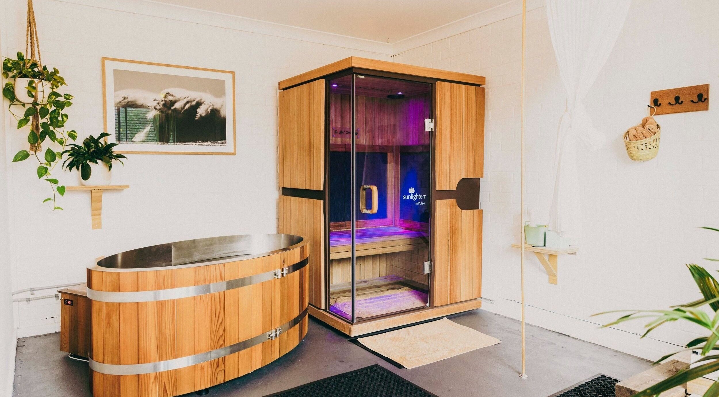 Relaxing sauna room at The Heal Zone - Avalon, Avalon Beach, New South Wales, AU with wooden design and plants.