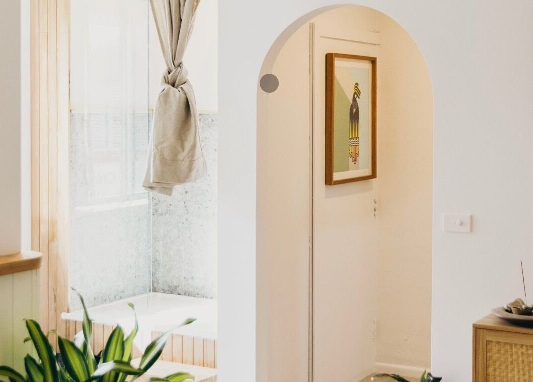 A serene corner at The Heal Zone - Avalon, Avalon Beach, New South Wales, AU, with plants and art decor.