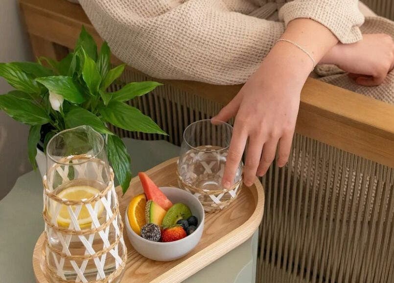 A serene setup at The Beauty Room Florida Beach in Dawesville with a fruit tray and drinks.