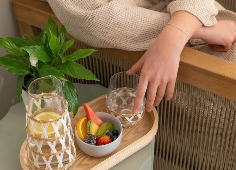 A serene setup at The Beauty Room Florida Beach in Dawesville with a fruit tray and drinks.