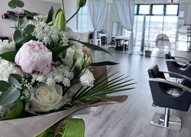 Beautiful bouquet in The Beauty Deck, Portland, England, GB, with salon chairs and serene interiors.