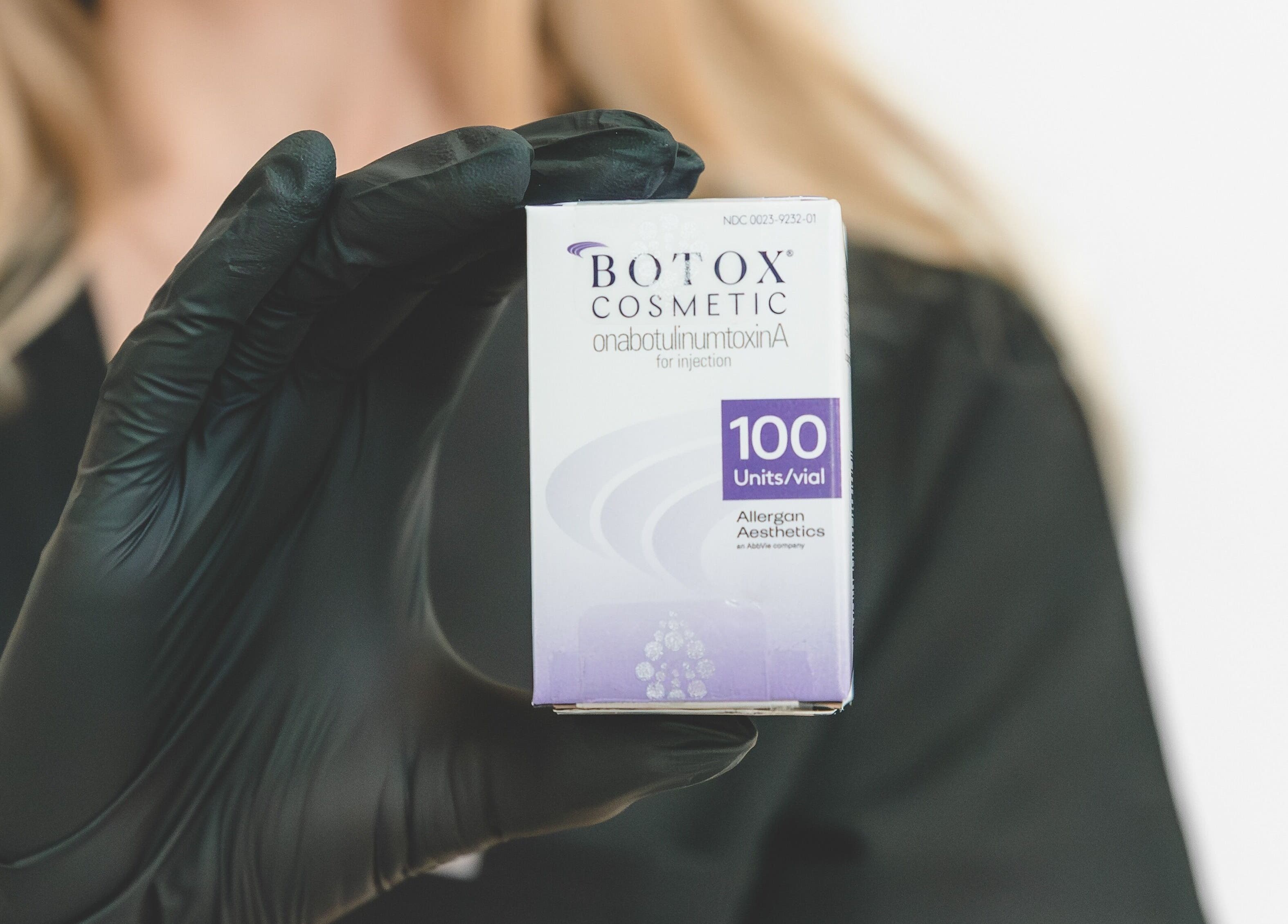 Close-up of Botox vial at Wagner Aesthetic Studio, De Pere, Wisconsin, US, held by a gloved hand.
