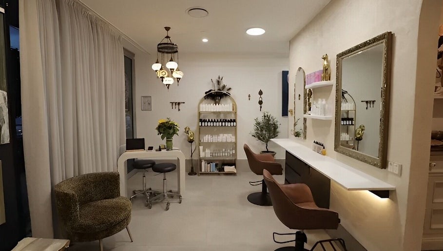 Chic interior of Sass & Soul Hair Studio in Maroochydore, Queensland, AU showcasing elegant salon seating and decor.