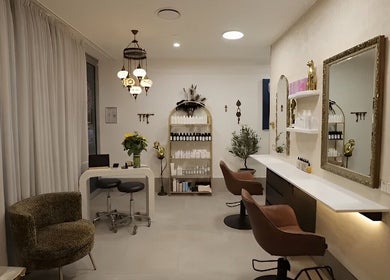 Chic interior of Sass & Soul Hair Studio in Maroochydore, Queensland, AU showcasing elegant salon seating and decor.