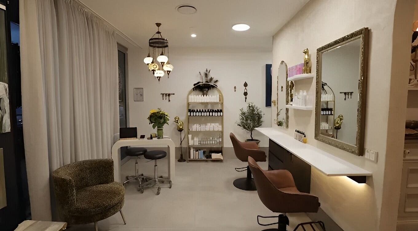 Chic interior of Sass & Soul Hair Studio in Maroochydore, Queensland, AU showcasing elegant salon seating and decor.