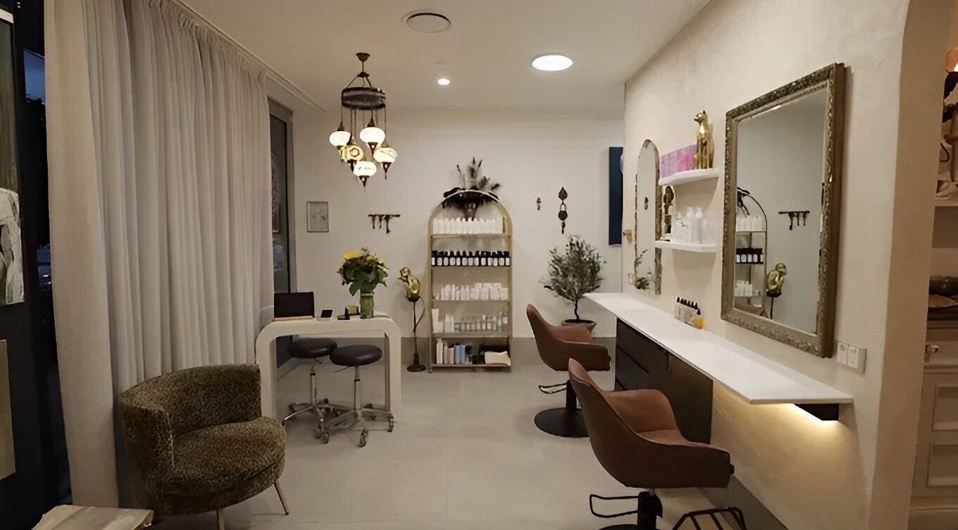 Chic interior of Sass & Soul Hair Studio in Maroochydore, Queensland, AU showcasing elegant salon seating and decor.