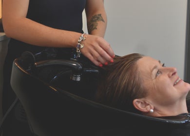 Client enjoying a relaxing hair wash at Sass & Soul Hair Studio, Maroochydore, Queensland, AU.