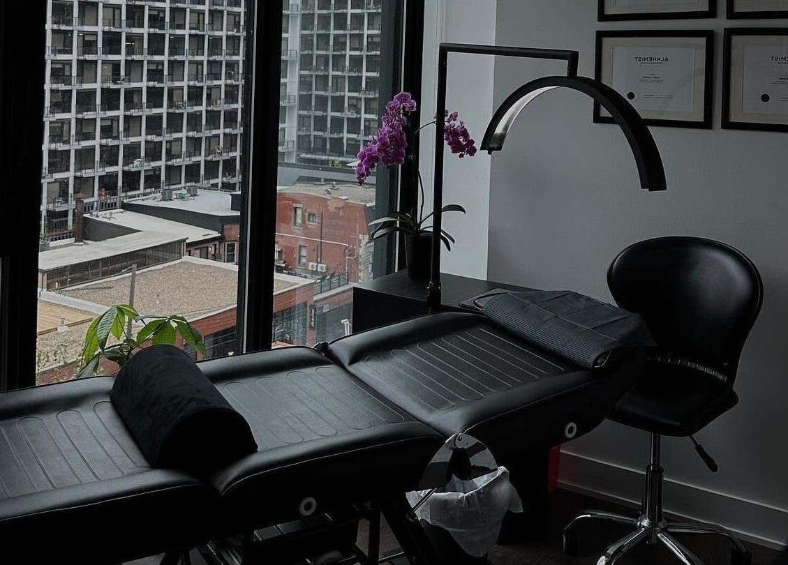 Cozy treatment room at Brows by Kasey, Verdun, Québec, CA with city view and black massage chair.