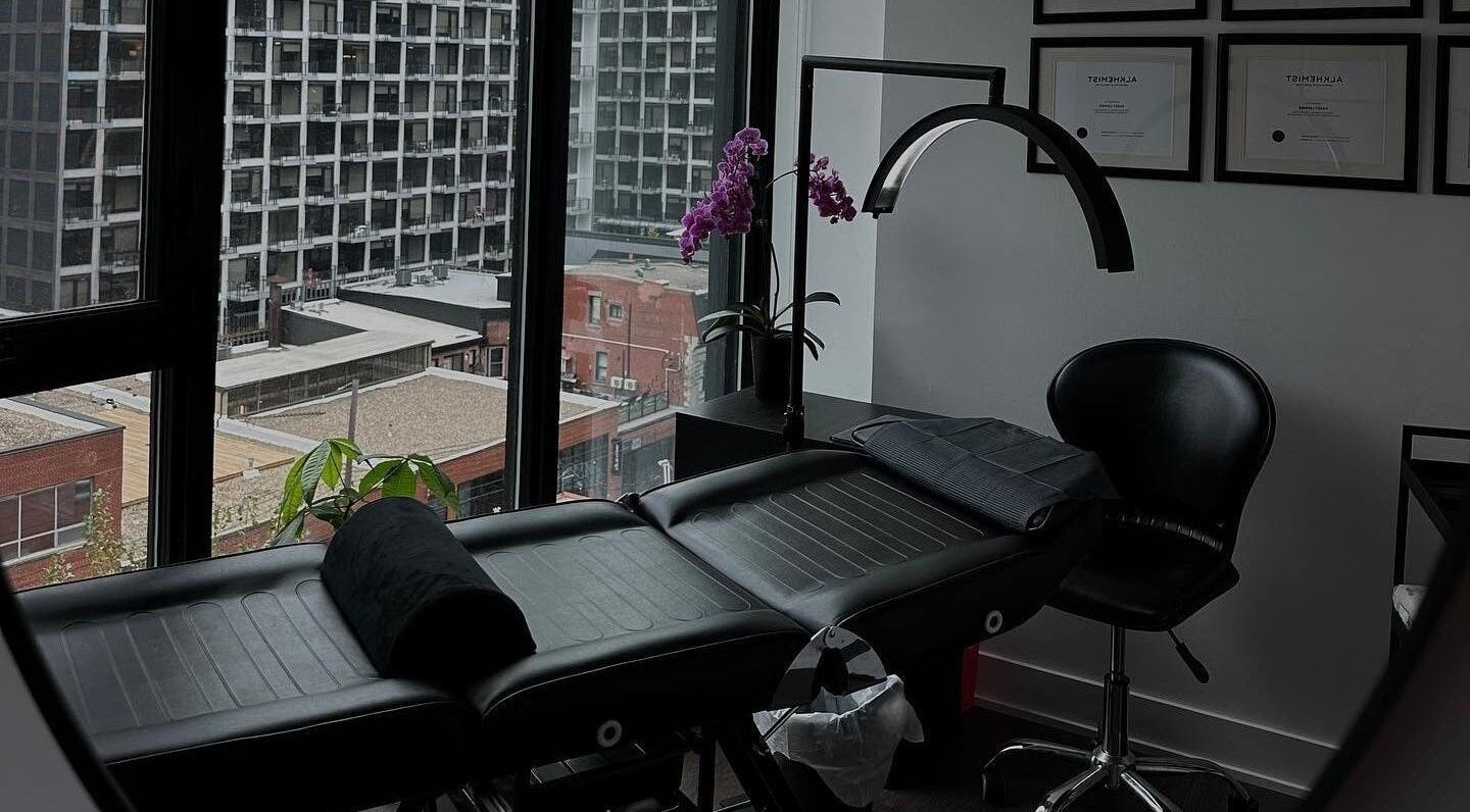 Cozy treatment room at Brows by Kasey, Verdun, Québec, CA with city view and black massage chair.