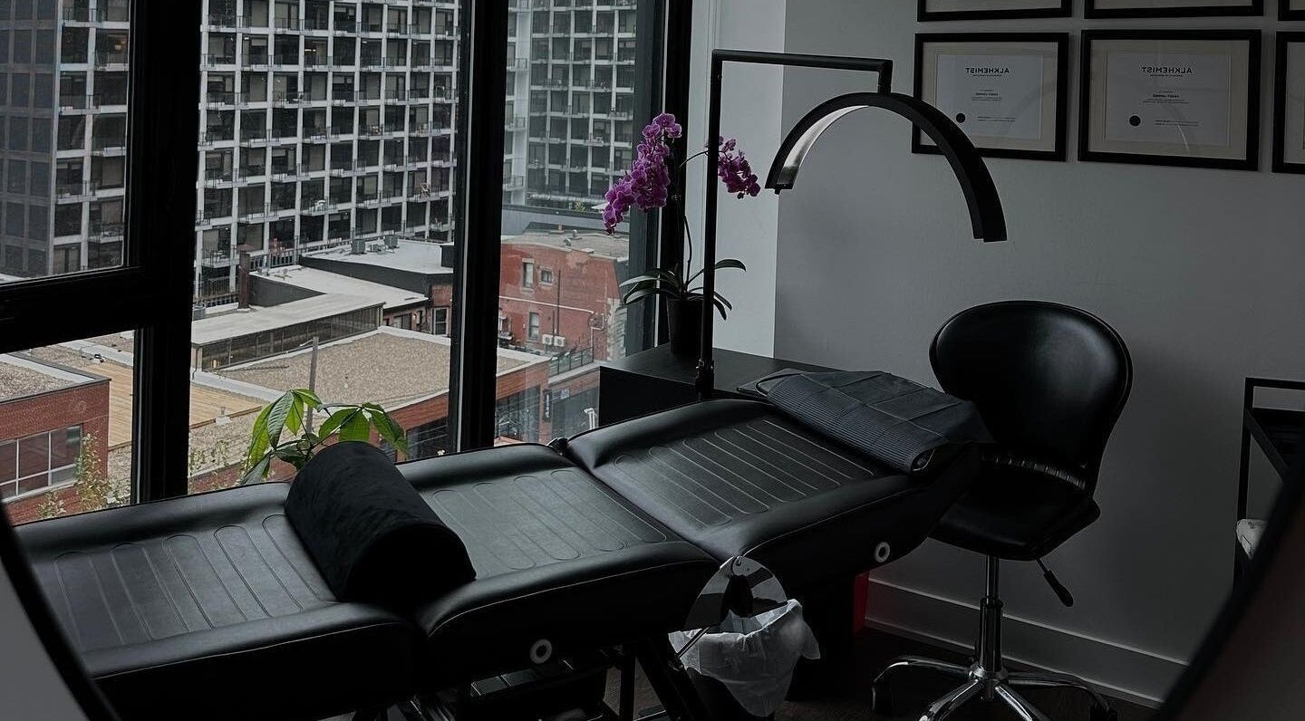 Cozy treatment room at Brows by Kasey, Verdun, Québec, CA with city view and black massage chair.