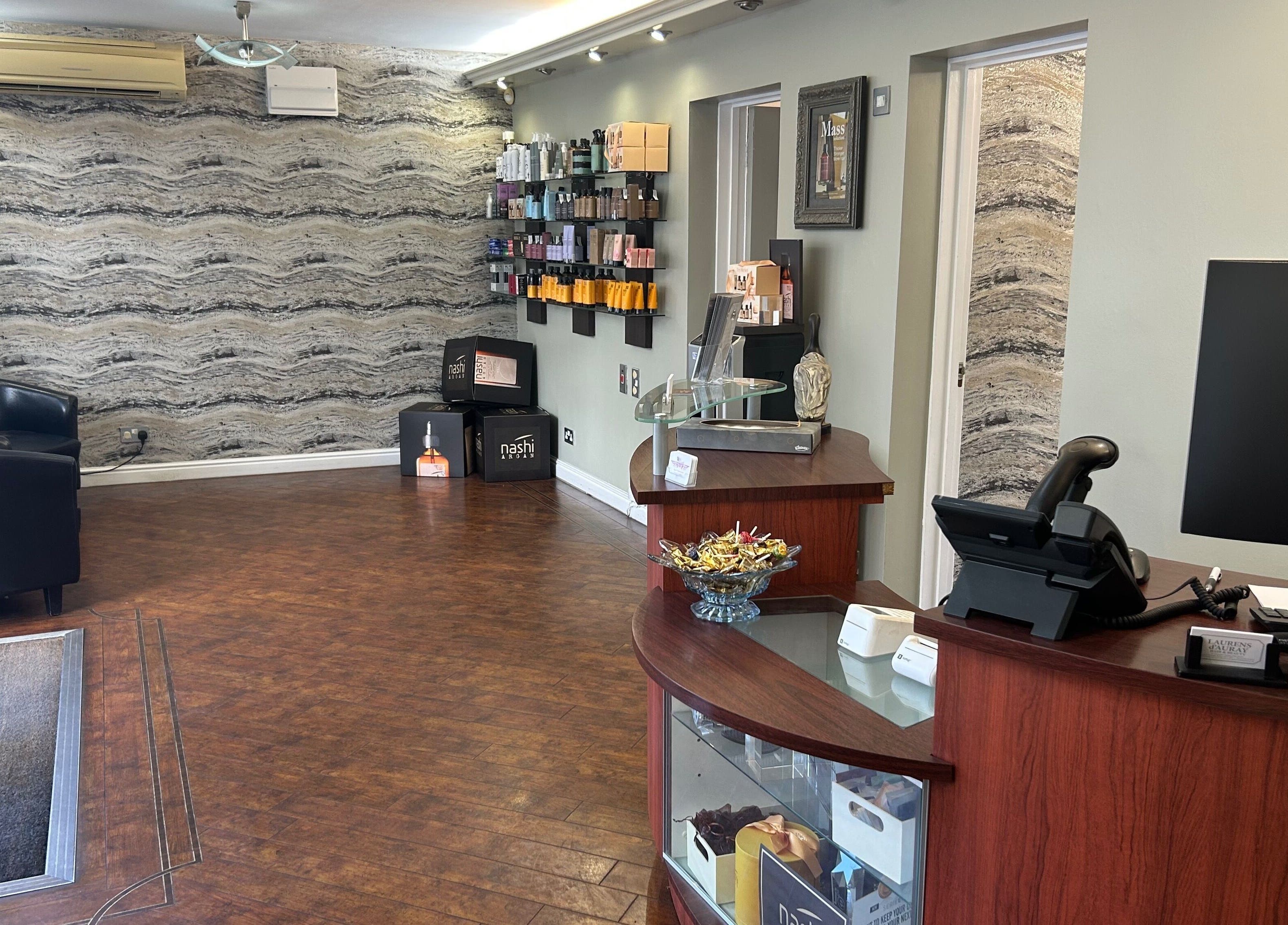 Reception area of Beautify in Stanford-le-hope, England, GB, featuring a stylish decor and product displays.