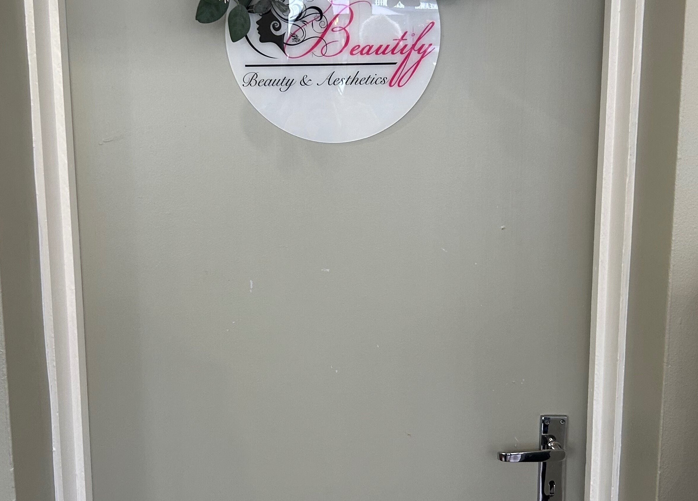 Entrance door of Beautify in Stanford-le-hope, England, GB featuring logo.