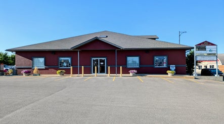 Front view of Derma Defined Esthetics in High River, Alberta, CA with a stylish exterior and clear signage.