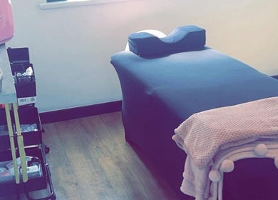 Cozy treatment room at Lani’s Lashes in Sheffield, England, GB, featuring a comfortable bed and beauty equipment.