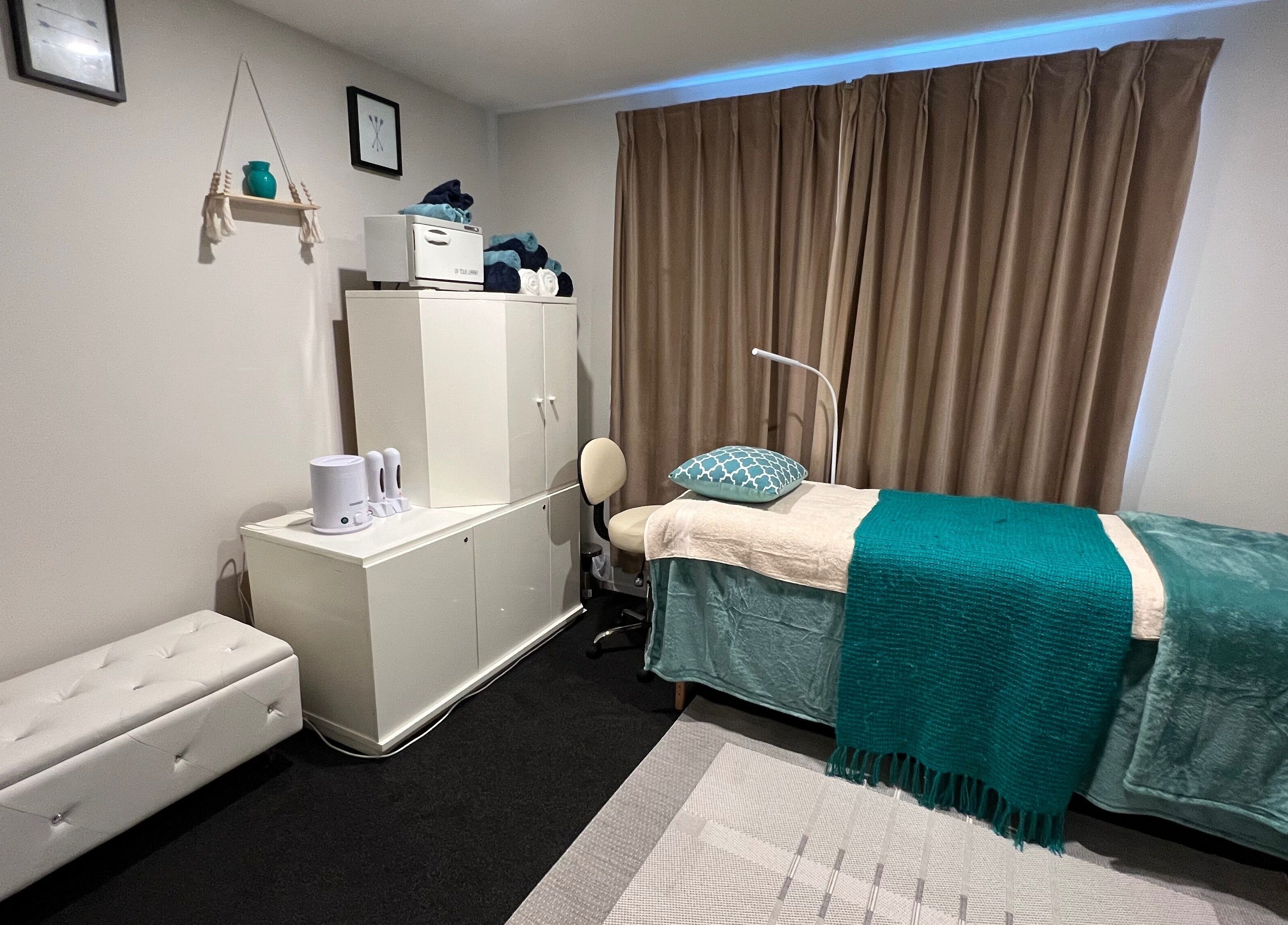 Relaxing treatment room at Classy Lash And Beauty Studio, Christchurch, Canterbury, NZ, with cozy decor.