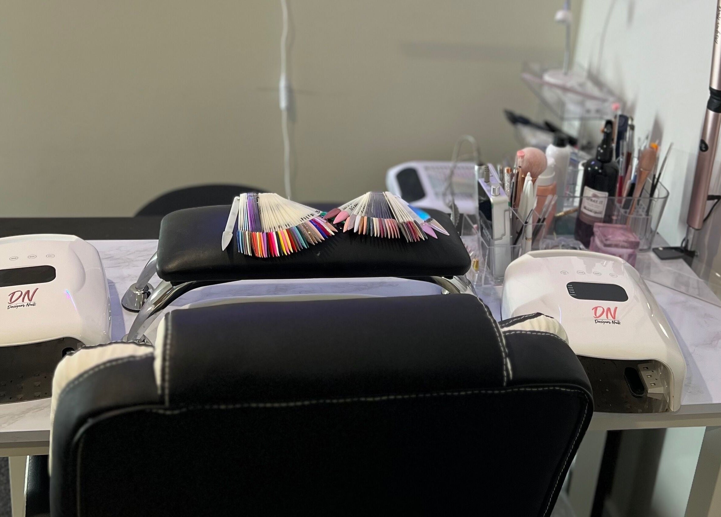 Manicure station at Classy Lash And Beauty Studio, Christchurch, Canterbury, NZ, featuring color samples.