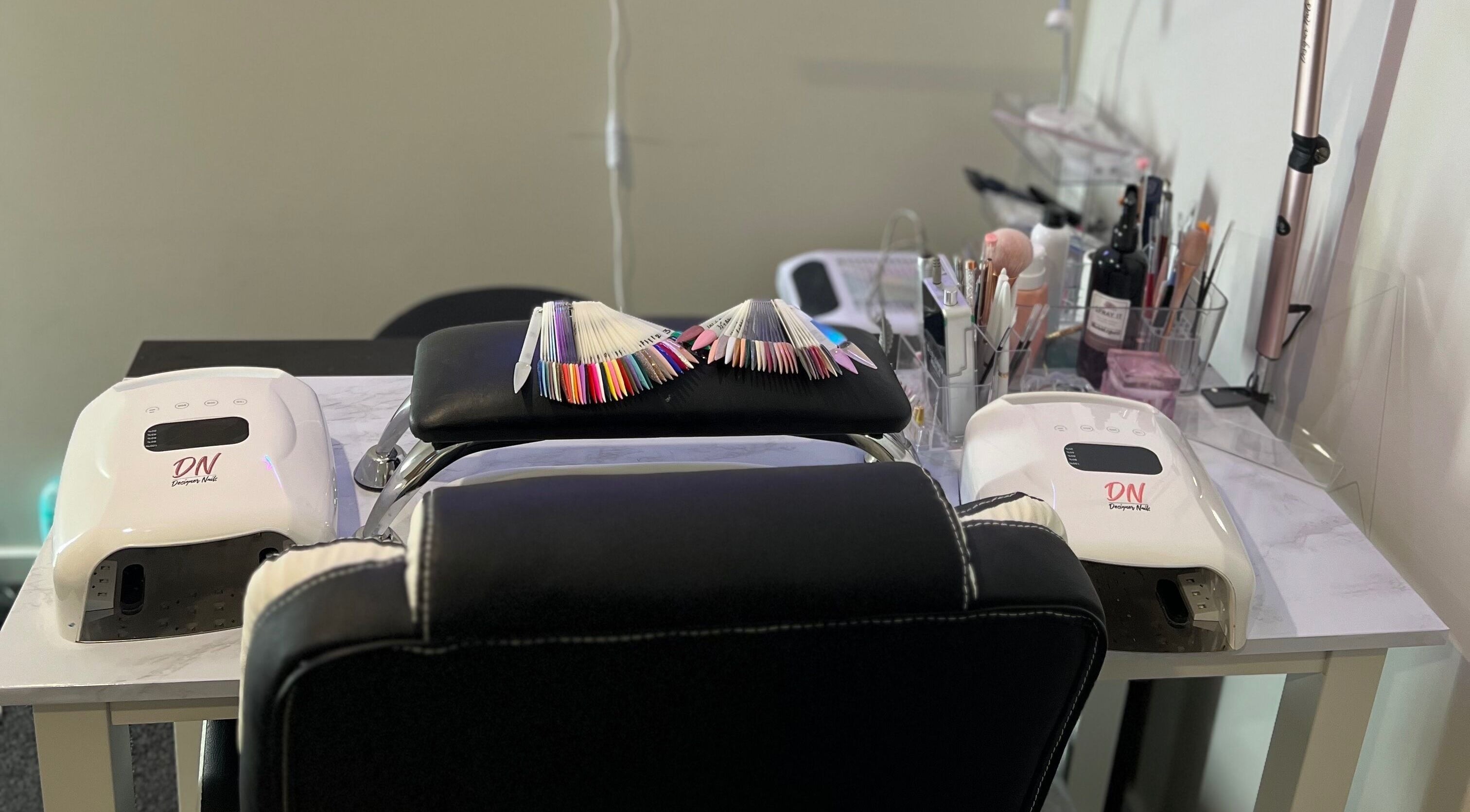 Manicure station at Classy Lash And Beauty Studio, Christchurch, Canterbury, NZ, featuring color samples.