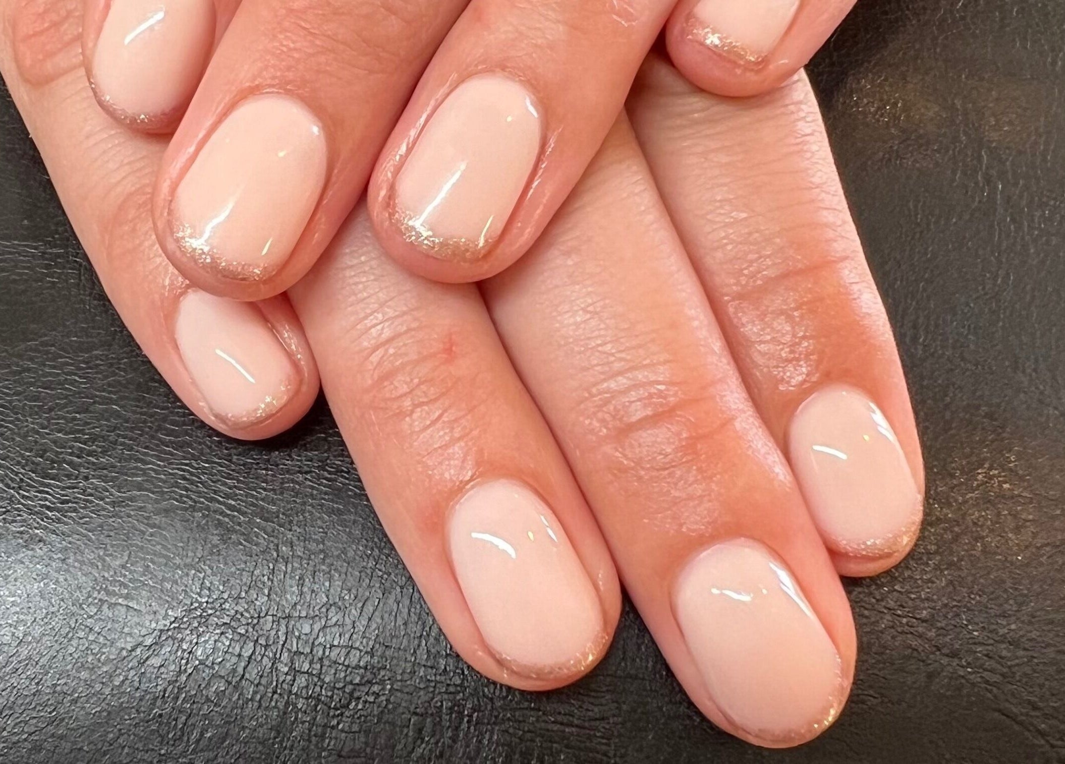 Elegant manicure at Classy Lash And Beauty Studio in Christchurch, Canterbury, NZ, showcasing glossy nude nails.