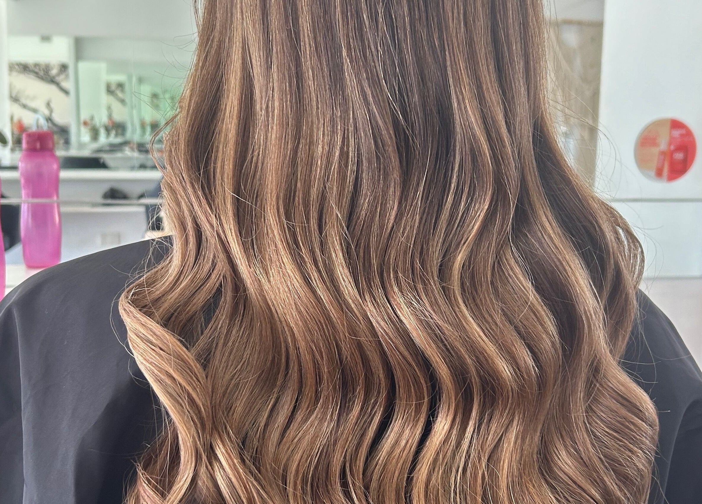 Elegant wavy hair styled at Styled by Jess Toohey, Marks Point, New South Wales, AU.