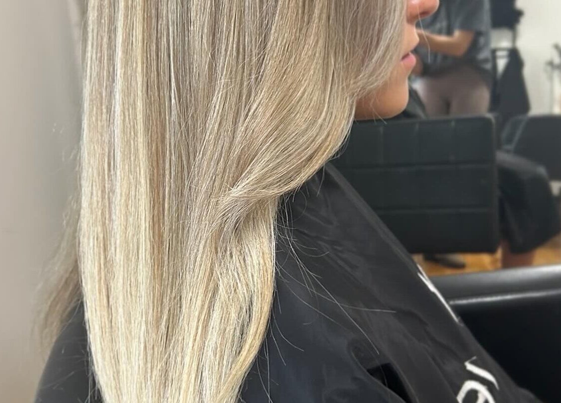 Sleek, beautifully styled blonde hair by Styled by Jess Toohey in Marks Point, New South Wales, AU.