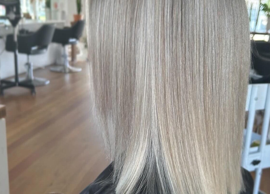 Sleek silver blonde hair styled at Styled by Jess Toohey, Marks Point, New South Wales, AU salon.