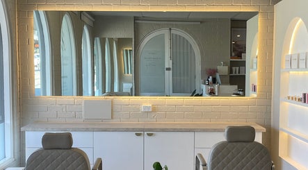 Elegant makeup studio interior at Ellie Schon Makeup Artist, Melbourne, Victoria, AU with modern chairs and mirrors.