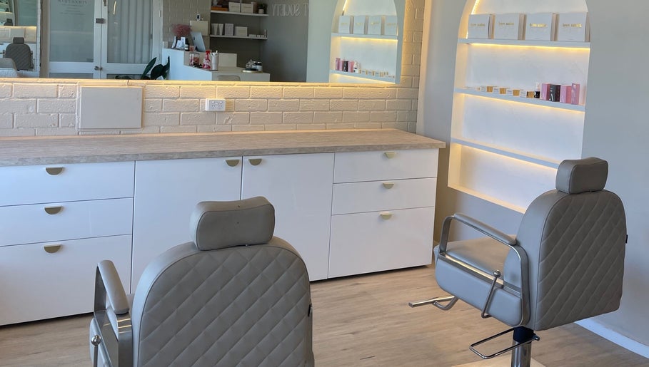 Elegant salon interior at Makeup By Courtney Jade / Coco Brows, Melbourne, Victoria, AU featuring styling chairs.